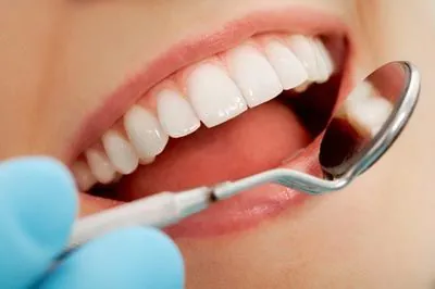 Dr. Meyer taking a look at a patient's teeth