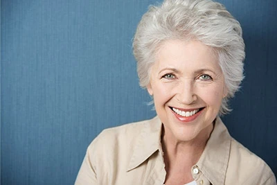 woman with dental implants smiling