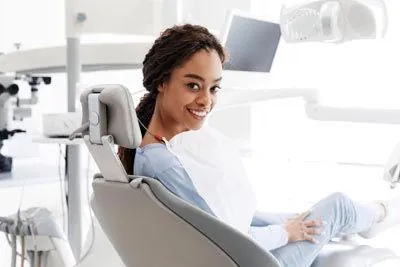 patient smiling after getting her teeth cleaned at Meyer Dentistry