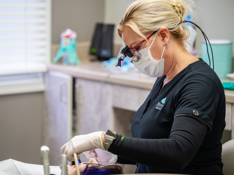 Michele from Greenville dental office Meyer Dentistry performing a dental checkup