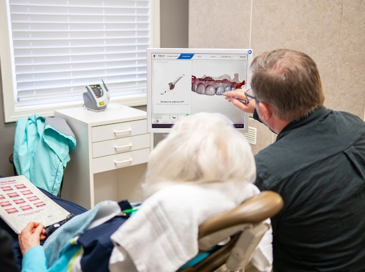 Greenville dentist Dr. Meyer showing a patient their dental x-rays