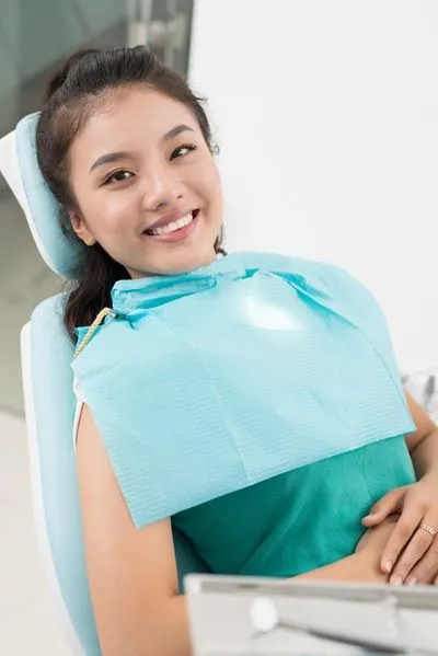 patient smiling during her restorative dentistry appointment